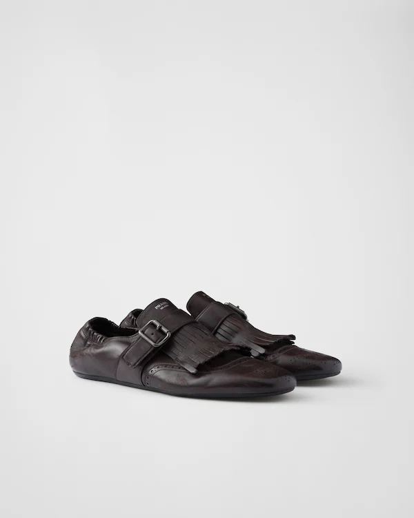 Sapatos monk com franjas e tiras
